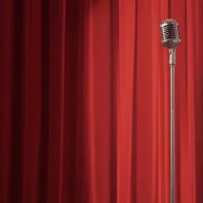 A Microphone On A Stage With Red Curtains In The Background 37 A55c
