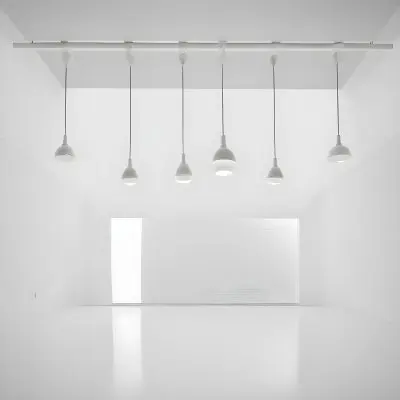 A Minimalist White Room With A High Ceiling And Hanging Pendant Lights 10 Ca23