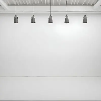 A Minimalist White Room With A High Ceiling And Hanging Pendant Lights 13 5126