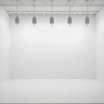 A Minimalist White Room With A High Ceiling And Hanging Pendant Lights 16 0019