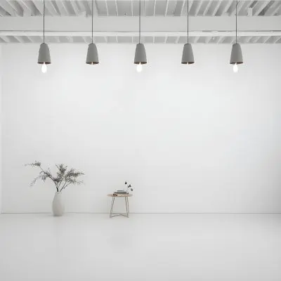 A Minimalist White Room With A High Ceiling And Hanging Pendant Lights 18 4da7