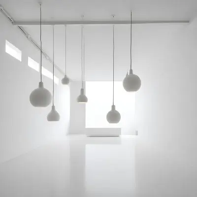 A Minimalist White Room With A High Ceiling And Hanging Pendant Lights 44 0af7
