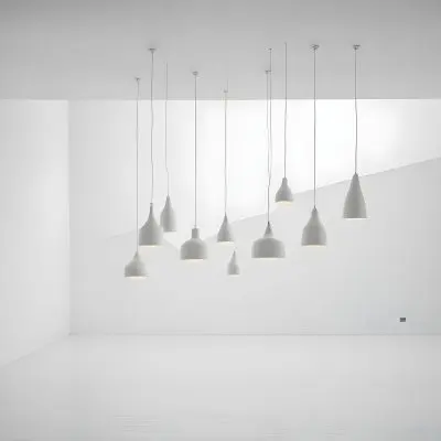A Minimalist White Room With A High Ceiling And Hanging Pendant Lights 6 9481