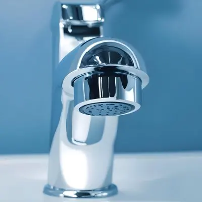 A Shiny Chrome Faucet With A Lever Handle Positioned On A White Countertop Set Against A Plain Blue Wall Showcasing A Modern Bathroom Fixture 8 Ab0a