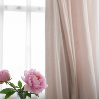 A Vase Of Pink Peonies On A Windowsill With Sheer Curtains In The Background 10 7f1a