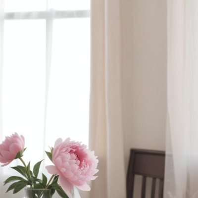 A Vase Of Pink Peonies On A Windowsill With Sheer Curtains In The Background 12 8cd8
