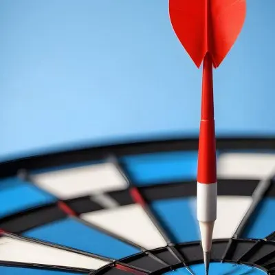 A White And Blue Target With An Arrow In The Center On A Blue Background 1 580d
