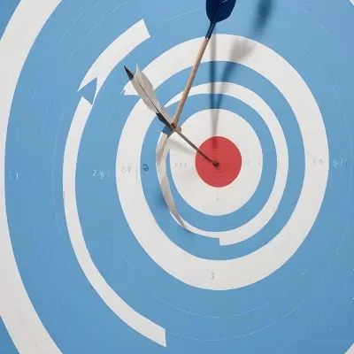 A White And Blue Target With An Arrow In The Center On A Blue Background 4 5b6c