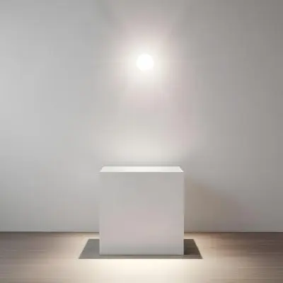 A White Cube Shaped Object On A Plain Background With A Bright Light Source Above It 12 F3a8