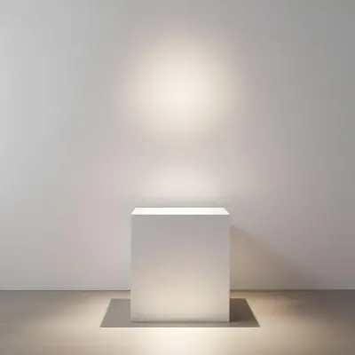 A White Cube Shaped Object On A Plain Background With A Bright Light Source Above It 14 398e
