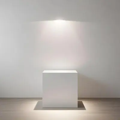 A White Cube Shaped Object On A Plain Background With A Bright Light Source Above It 2 9afe