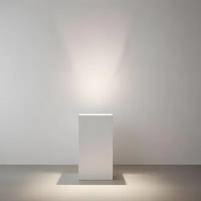 A White Cube Shaped Object On A Plain Background With A Bright Light Source Above It 8 B4ad