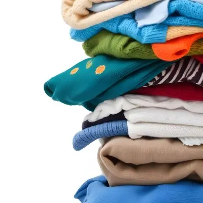 Pile Of White Folded Clothes Including Sweaters Pants And Sweaters Stacked Haphazardly On Top Of Each Other Creating A Organized And Organized Mess Colorful Background 11 874f