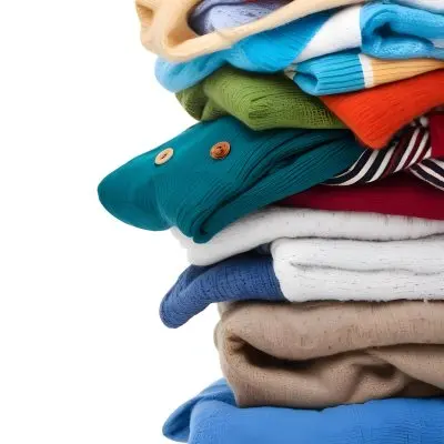 Pile Of White Folded Clothes Including Sweaters Pants And Sweaters Stacked Haphazardly On Top Of Each Other Creating A Organized And Organized Mess Colorful Background 18 E5e1