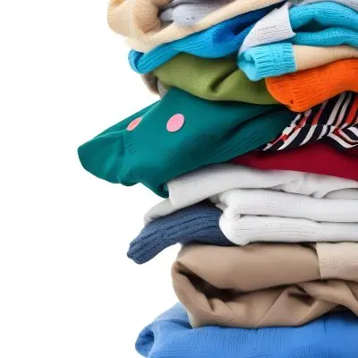 Pile Of White Folded Clothes Including Sweaters Pants And Sweaters Stacked Haphazardly On Top Of Each Other Creating A Organized And Organized Mess Colorful Background 29 B196