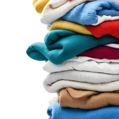 Pile Of White Folded Clothes Including Sweaters Pants And Sweaters Stacked Haphazardly On Top Of Each Other Creating A Organized And Organized Mess Colorful Background 34 80ab