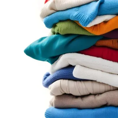 Pile Of White Folded Clothes Including Sweaters Pants And Sweaters Stacked Haphazardly On Top Of Each Other Creating A Organized And Organized Mess Colorful Background 35 Ecde