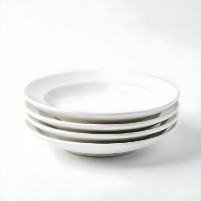 Stack Of Ten White Ceramic Plates Simple Design Uniform Size Smooth Surface Minimalist Aesthetic Clean Presentation White Background 9 9bda