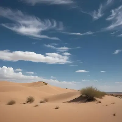 A Desert Landscape With Sand Dunes And Sparse Vegetation Under A Bright Blue Sky With Wispy Clouds Arid Environment 32 5824