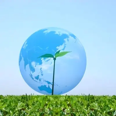 A Globe With A Plant Growing Inside On A Green Grass Field With A Clear Blue Sky In The Background Symbolizing Environmental Conservation And Sustainability 15 371d