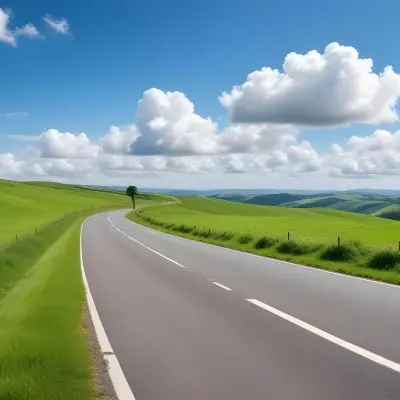 A Long Winding Road Through A Lush Green Countryside With Rolling Hills And Fluffy White Clouds In A Bright Blue Sky 12 05c7