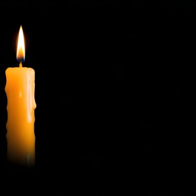 A Burning Candle With A Bright Flame The Wax Is Dripping Down The Side Casting A Warm Glow In A Dark Room 21 0e40