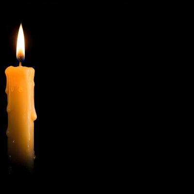 A Burning Candle With A Bright Flame The Wax Is Dripping Down The Side Casting A Warm Glow In A Dark Room 22 43a7