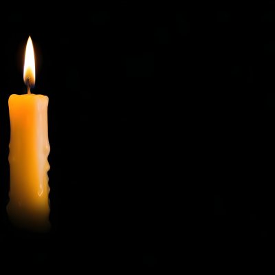 A Burning Candle With A Bright Flame The Wax Is Dripping Down The Side Casting A Warm Glow In A Dark Room 29 A8d2