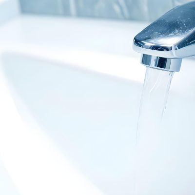 A Chrome Faucet With Water Running Into A White Sink The Background Is White 6 8fcd