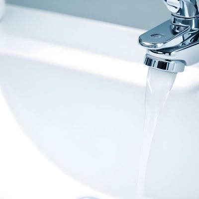 A Chrome Faucet With Water Running Into A White Sink The Background Is White 9 1489