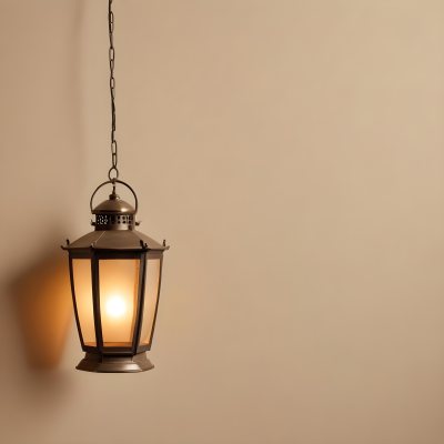A Hanging Lantern With A Warm Glowing Light Against A Plain Beige Wall 27 E21f
