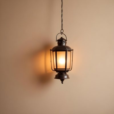 A Hanging Lantern With A Warm Glowing Light Against A Plain Beige Wall 30 12de
