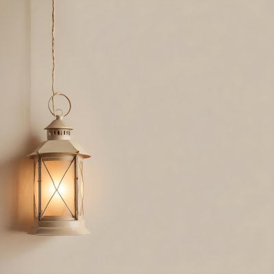 A Hanging Lantern With A Warm Glowing Light Against A Plain Beige Wall 33 77ae