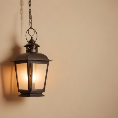 A Hanging Lantern With A Warm Glowing Light Against A Plain Beige Wall 39 8f3e