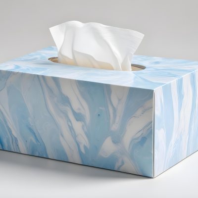 A Light Blue Tissue Box With A Marble Pattern Filled With White Tissues Sitting On A White Surface With A White Background 16 7ee1