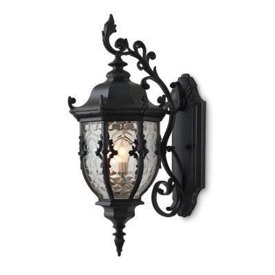 An Ornate Black Metal Outdoor Wall Sconce With A Glass Pane Design Mounted On A Brick Wall 2 404c