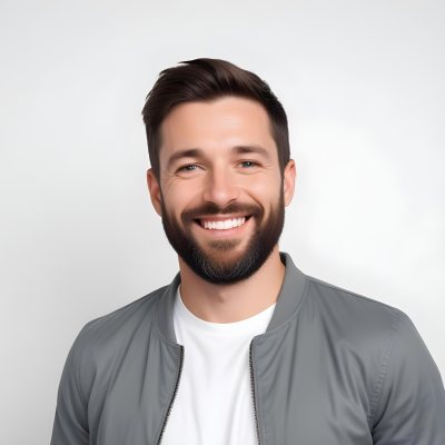 A White Man 35 Years Old With Short Dark Hair And A Beard Wearing A White T Shirt And A Gray Jacket Smiling In A White Background 11 Fbdd