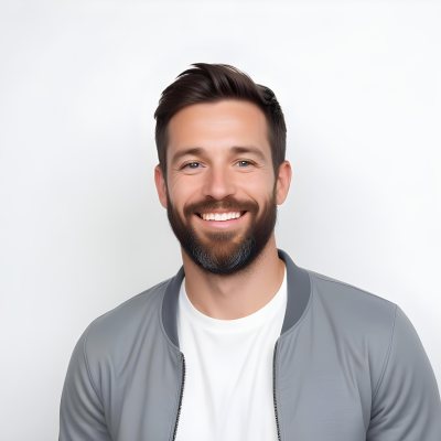 A White Man 35 Years Old With Short Dark Hair And A Beard Wearing A White T Shirt And A Gray Jacket Smiling In A White Background 12 62ce
