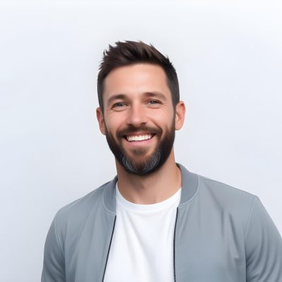 A White Man 35 Years Old With Short Dark Hair And A Beard Wearing A White T Shirt And A Gray Jacket Smiling In A White Background 24 4c13