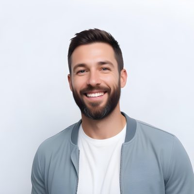 A White Man 35 Years Old With Short Dark Hair And A Beard Wearing A White T Shirt And A Gray Jacket Smiling In A White Background 5 1fdd