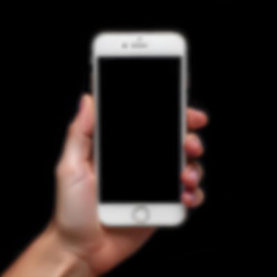 A Fair Skinned Hand Holding A White Smartphone With A Blank Black Screen Isolated On A Black Background 15 E4ad