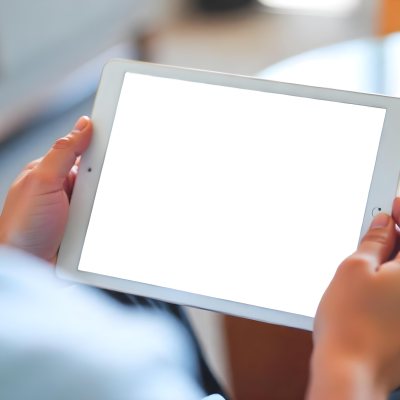 A Person Holding A Tablet With A Blank Blue Screen The Background Is Blurred And Out Of Focus The Person Is Wearing A White Shirt 16 C516