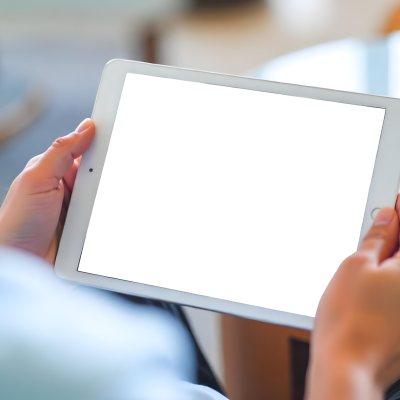 A Person Holding A Tablet With A Blank Blue Screen The Background Is Blurred And Out Of Focus The Person Is Wearing A White Shirt 30 630e
