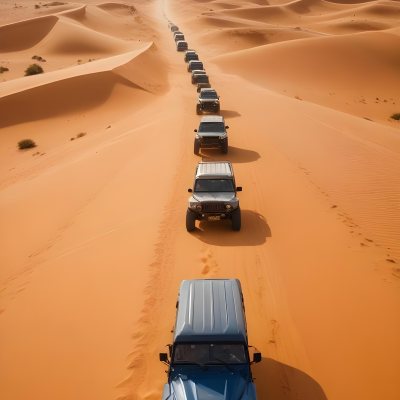 A Convoy Of Off Road Vehicles Driving Through A