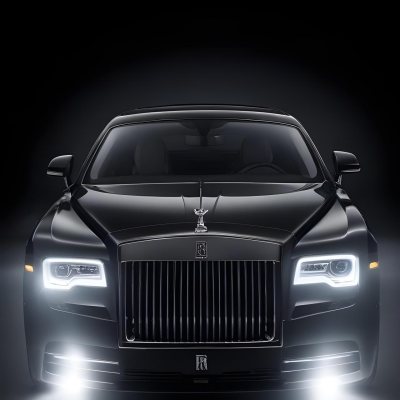 A Sleek Dark Colored Luxury Sedan With A Prominent Grille Featuring The Rolls Royce Logo Illuminated Headlights And A Minimalist Elegant Design 17 Bbb2