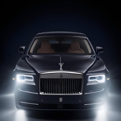 A Sleek Dark Colored Luxury Sedan With A Prominent Grille Featuring The Rolls Royce Logo Illuminated Headlights And A Minimalist Elegant Design 7 64d6