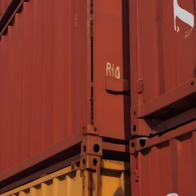 Red Cargo Containers Stacked On Top Of Each Other With A Metal Latch Visible On The Side Of One Of The Containers In A Sunny Environment Against A Background Of A Shipping Yard 21 3d45
